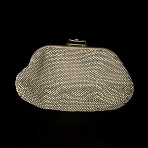 Reversible silver/creme clutch